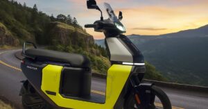 TVS Orbiter Electric Scooter 2025 on Hilly Road Background